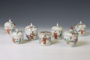China, seven small famille rose porcelain 'boys' boxes and covers, 19th-20th century,