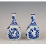 China, a pair of small blue and white porcelain bottle vases, Kangxi period (1662-1722),