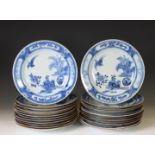 China, a set of twenty-four blue and white porcelain 'Cuckoo in the House' plates, 18th century,