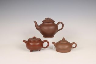 China, three Yixing earthenware teapots and covers, 19th-20th century,