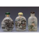 China, three reverse glass painted 'landscape' snuff bottles and stoppers, 20th century,