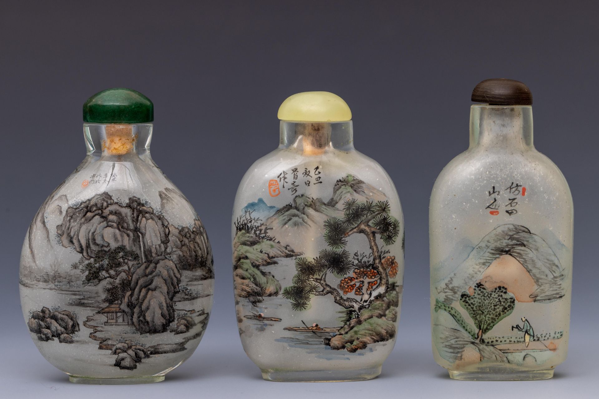 China, three reverse glass painted 'landscape' snuff bottles and stoppers, 20th century,
