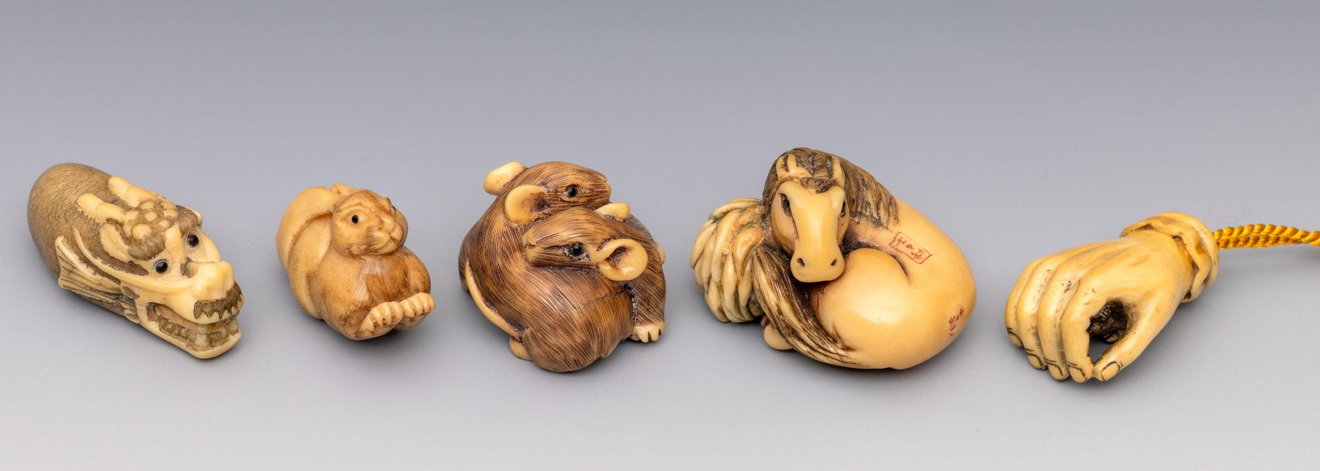 Five mostly tagua nut netsukes, 20th century