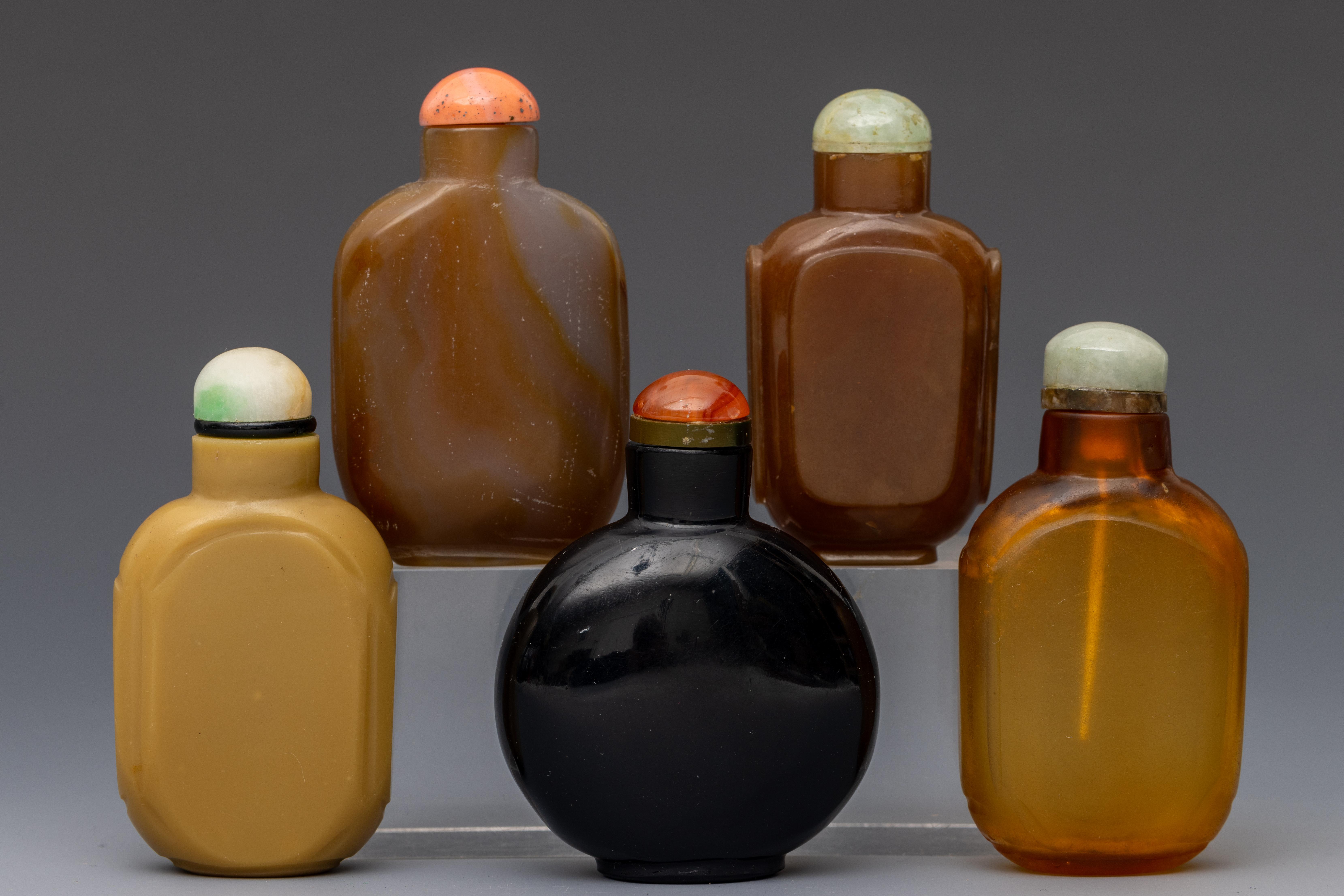 China, five glass snuff bottles and stoppers, late Qing dynasty (1644-1912),