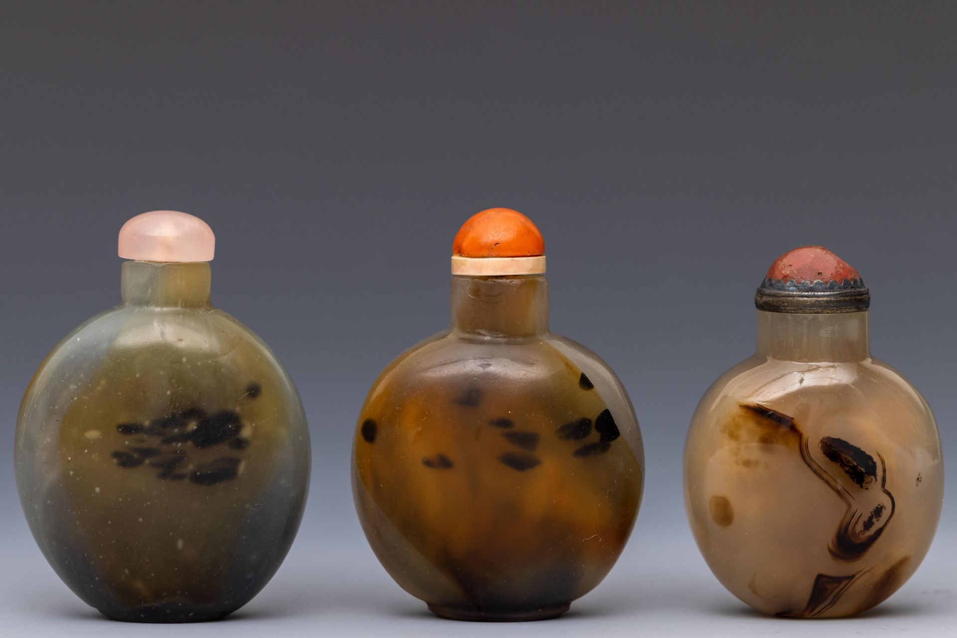 China, three agate snuff bottles and covers,