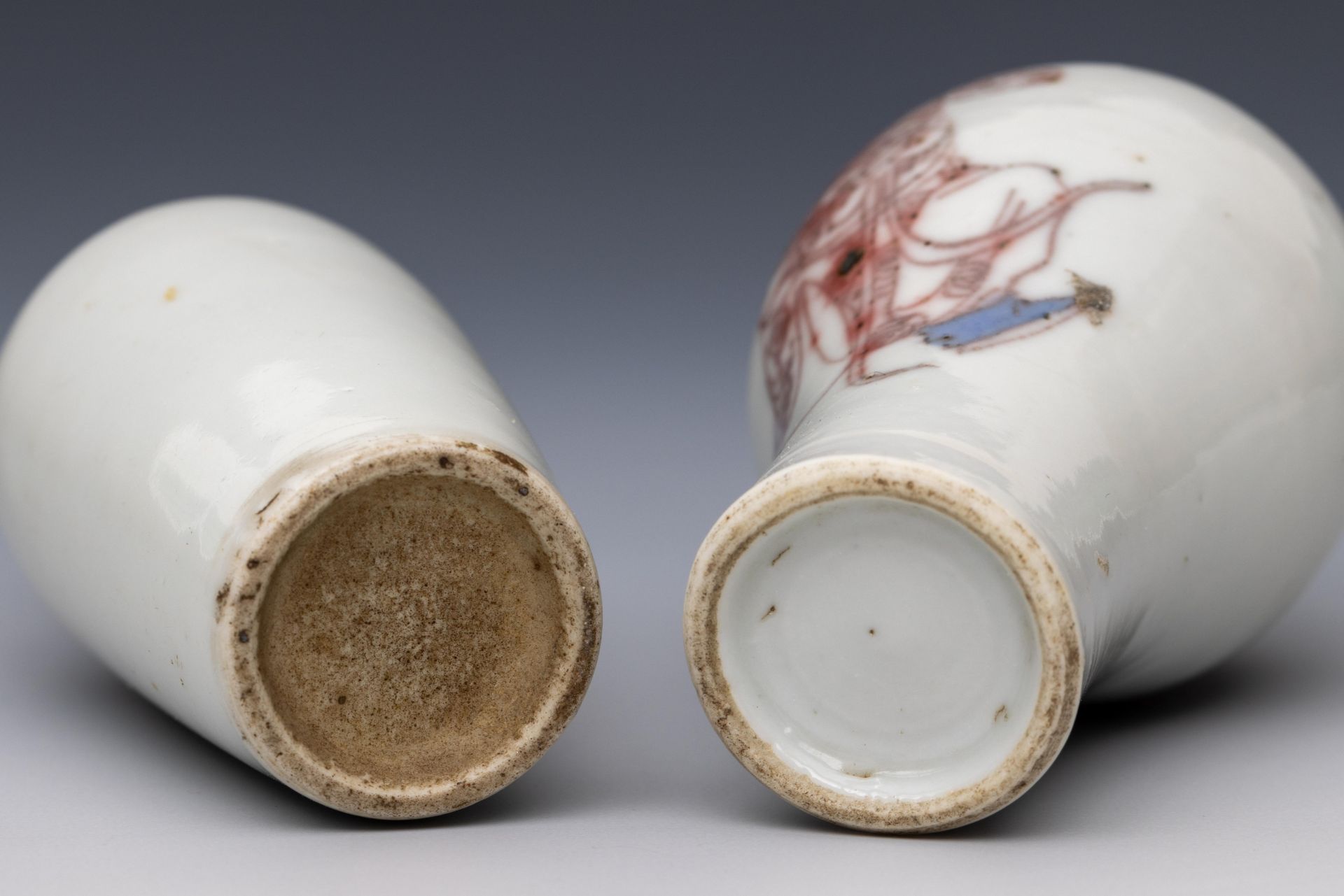 China, two blue and white and iron-red porcelain 'warrior' snuff bottles and stoppers, 19th century, - Image 2 of 3