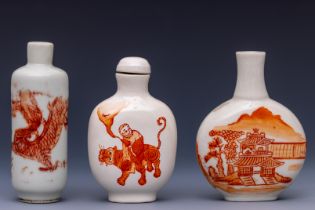 China, three iron-red decorated porcelain snuff bottles and one stopper, late 19th/ 20th century,