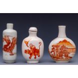 China, three iron-red decorated porcelain snuff bottles and one stopper, late 19th/ 20th century,