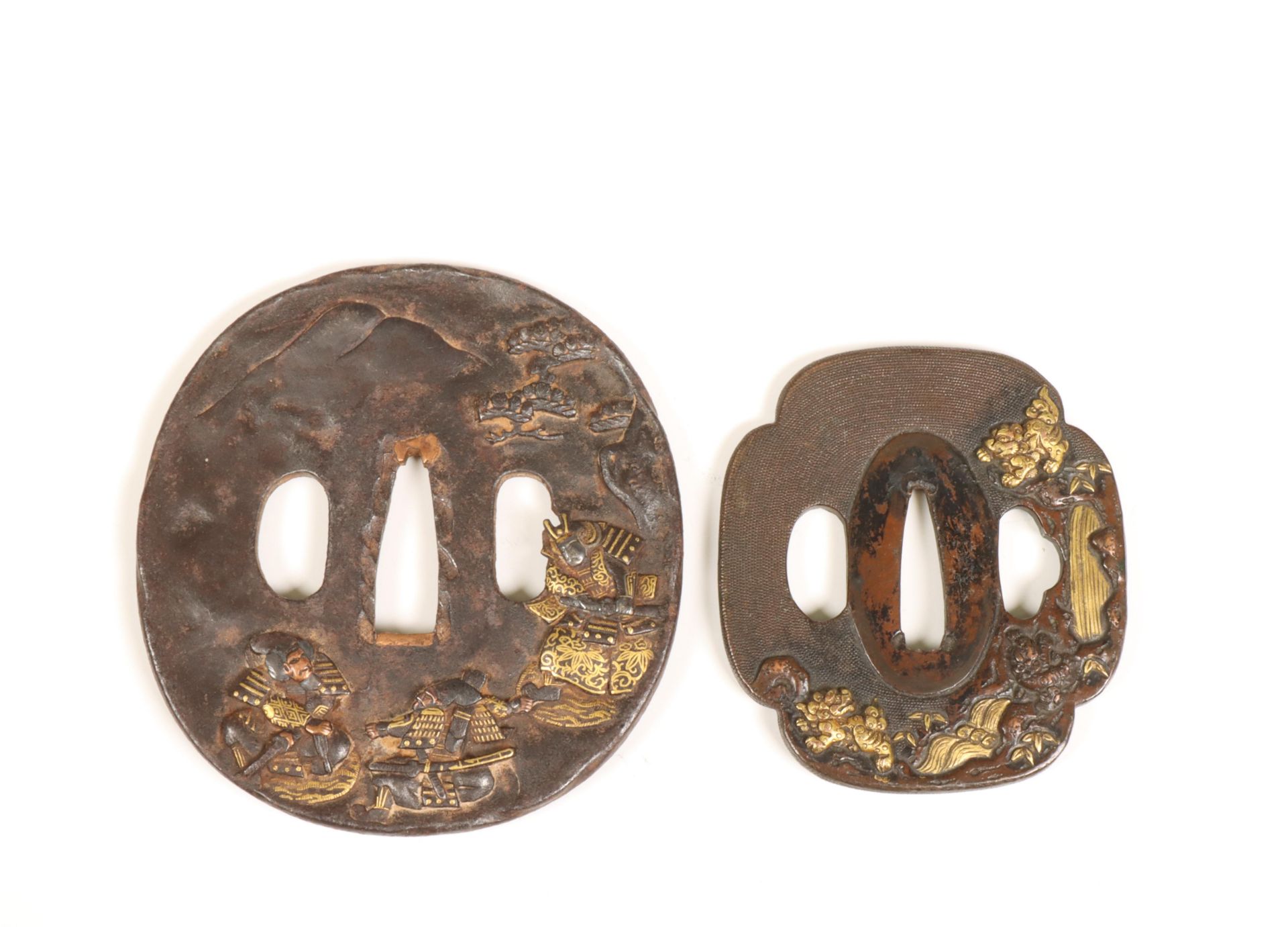 Japan, two iron tsuba's with gold- and silver inlay, Edo period (1615-1868);