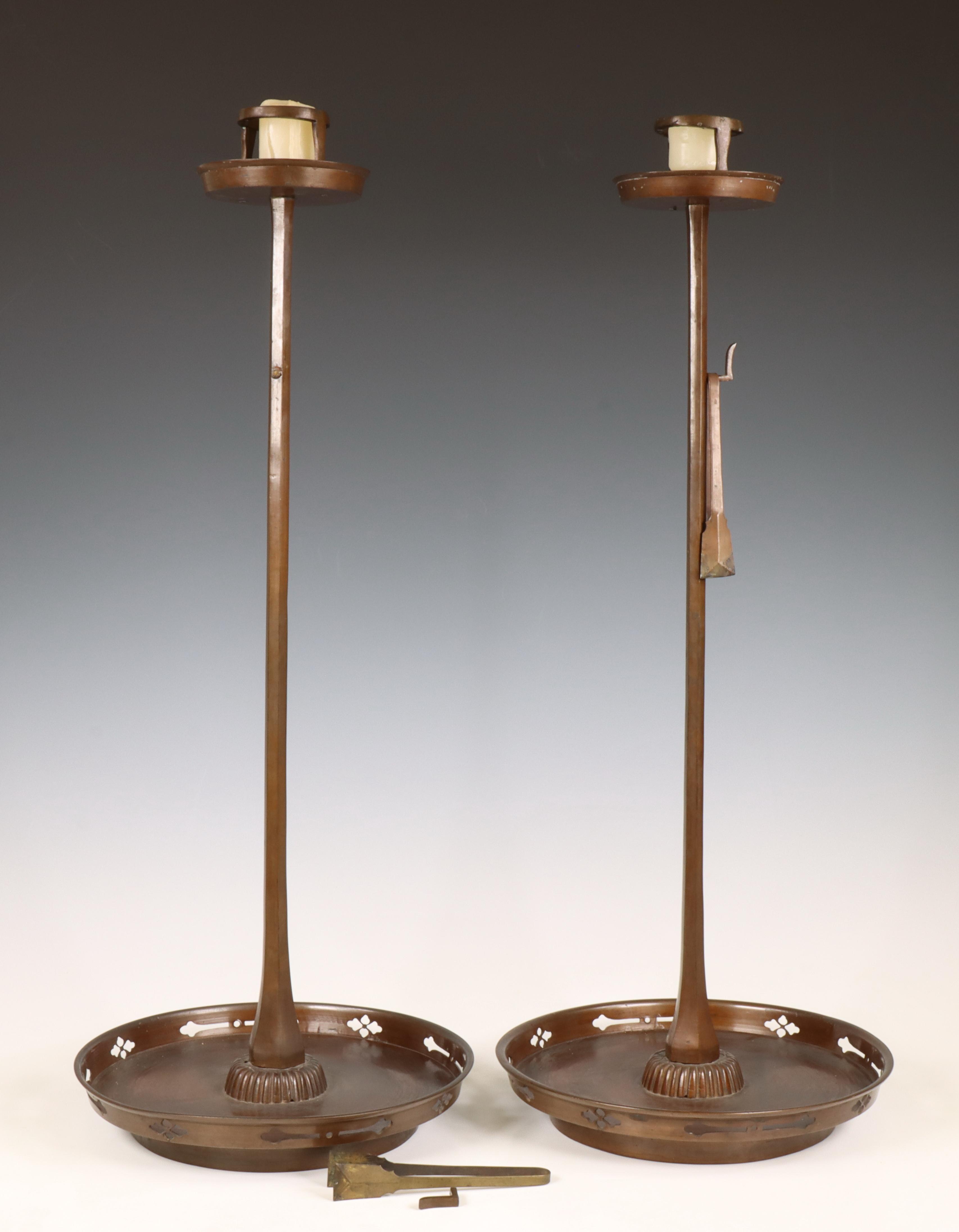 Japan, a pair of brown patinated bronze altar candlesticks, Meiji period (1868-1912),