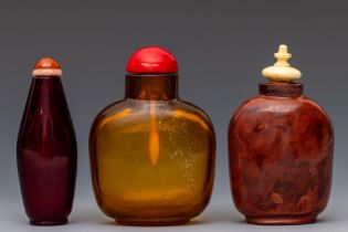 China, three glass snuff bottles and stoppers, late Qing dynasty (1644-1912),