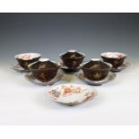 Japan, set of five lacquer-decorated porcelain cups, six saucers, and three covers, Meiji period (18