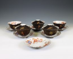 Japan, set of five lacquer-decorated porcelain cups, six saucers, and three covers, Meiji period (18