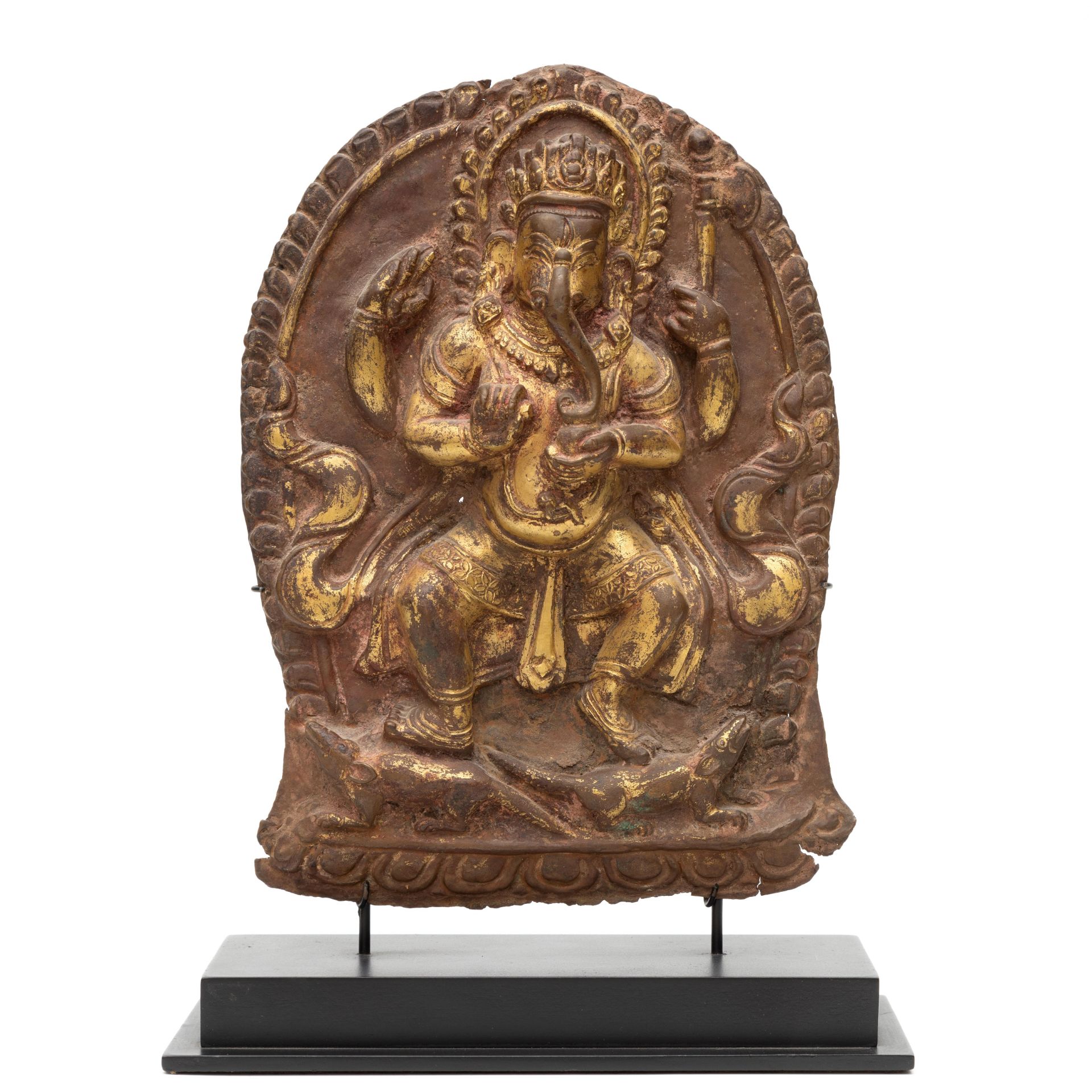 Nepal, a gild copper alloy repousse plaque depicting a standing Ganesha, 17th-18th century