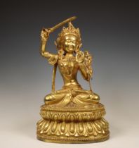 Tibeto-China, gilt bronze figure of Manjushri, 20th century,