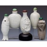 China, five white-glazed ceramic snuff bottles and stoppers, late Qing dynasty (1644-1912),