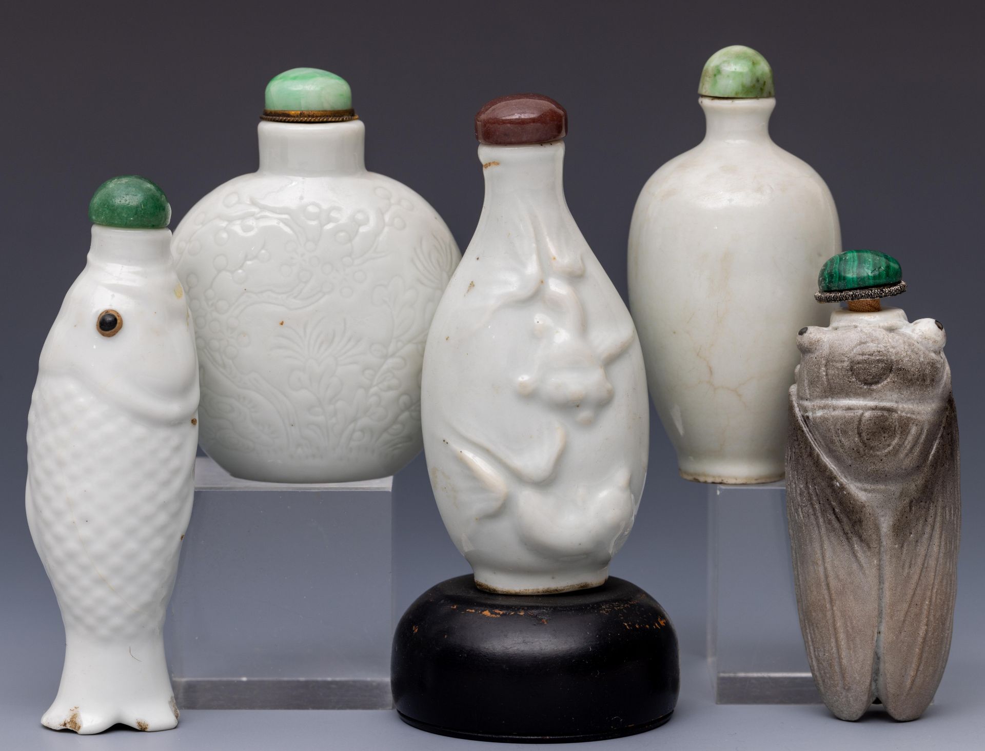 China, five white-glazed ceramic snuff bottles and stoppers, late Qing dynasty (1644-1912),