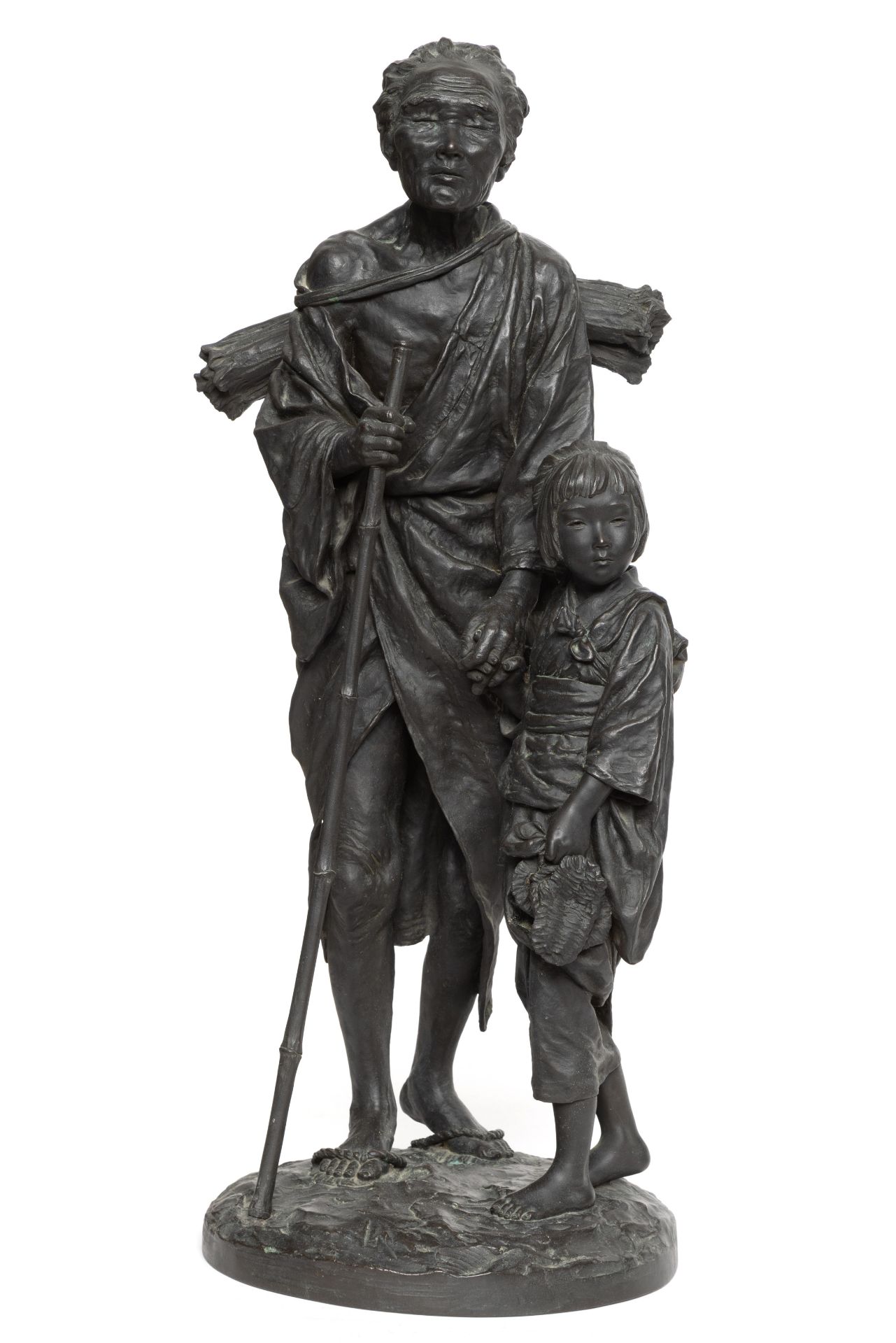 Japan, black patinated bronze okimono, depicting blind woman with child, Meiji (1868-1912);