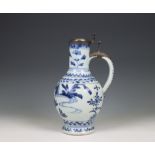 Japan, Arita blue and white silver-mounted porcelain jug, 17th century, the silver later,