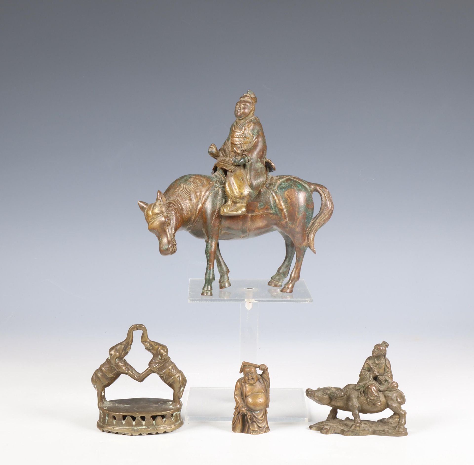 China, two bronze figures of Wise man on a horse and a buffalo, a smaller messing figure of a Chines