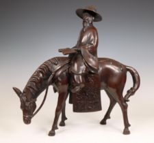 China, a bronze model of a scholar riding a horse, 20th century,