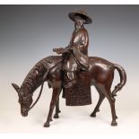 China, a bronze model of a scholar riding a horse, 20th century,