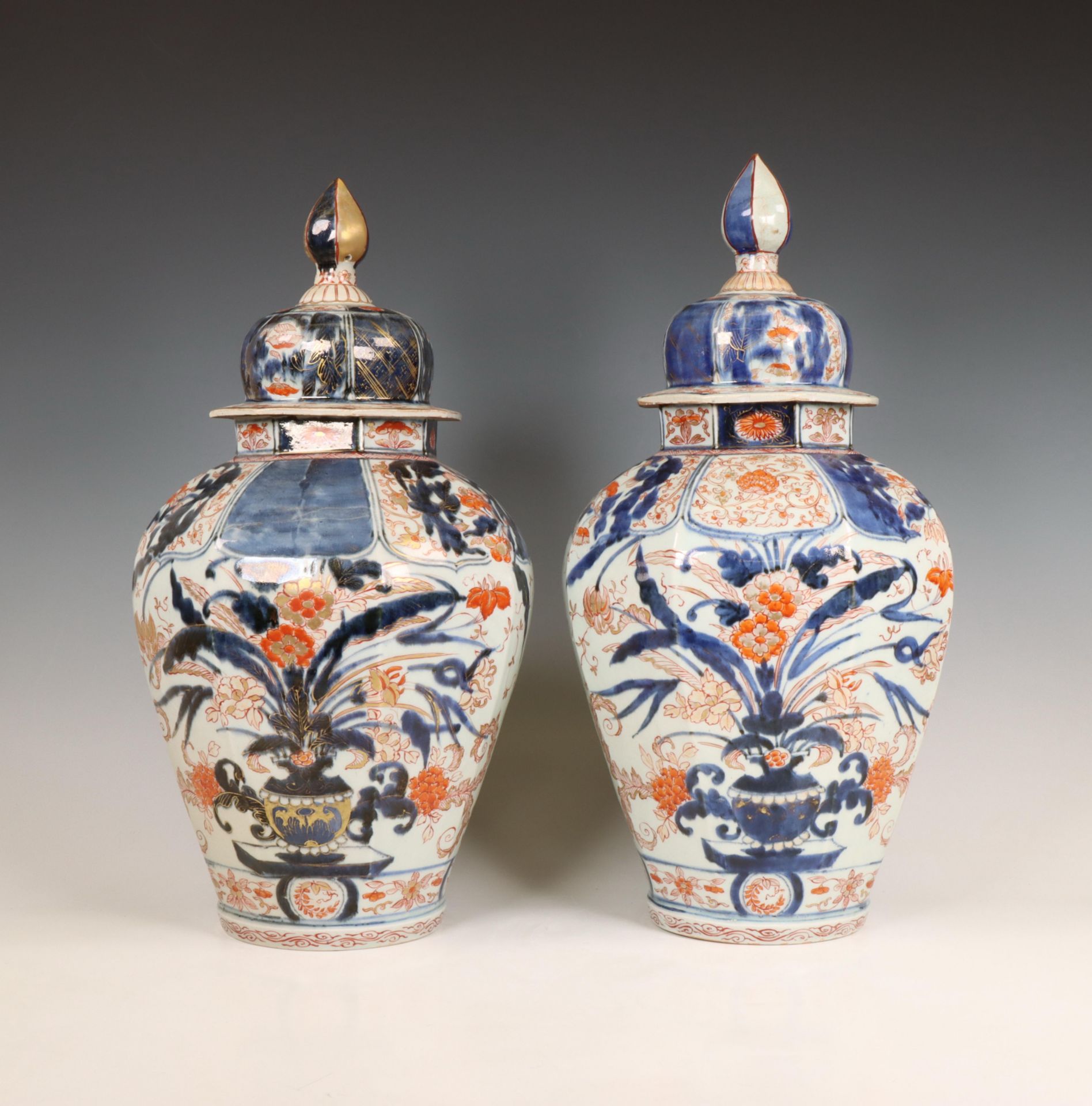 Japan, a pair of octagonal Imari porcelain baluster jars and covers, 17th-18th century,