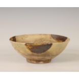 China, a cream-glazed pottery bowl, probably Tang dynasty (618-907),