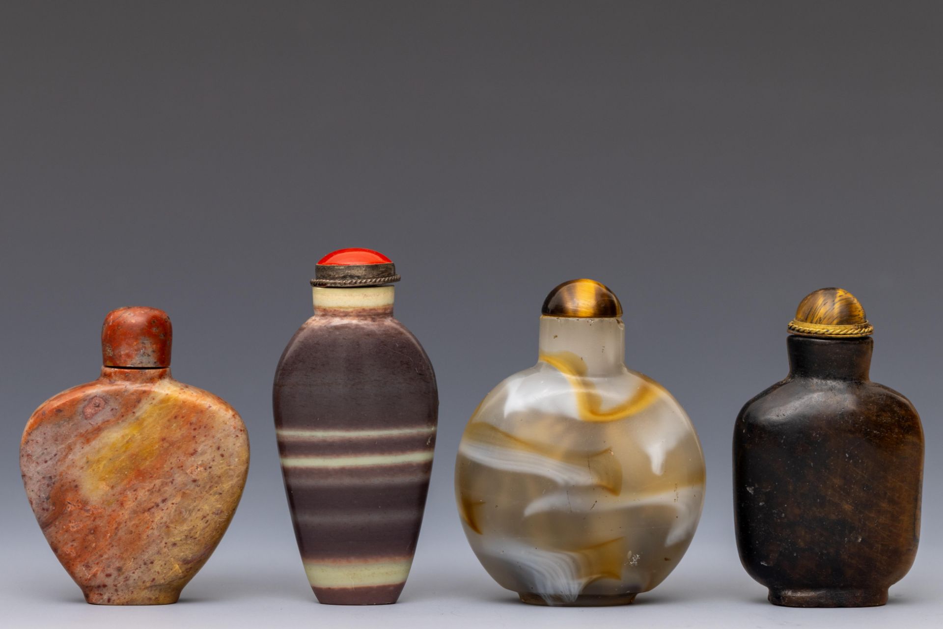 China, four hardstone snuff bottles and covers,