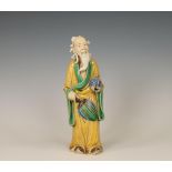 China, a biscuit sancai-glazed figure of an Immortal, modern,