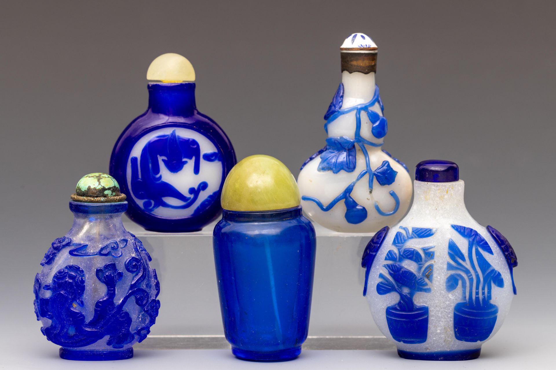 China, five blue overlay glass and blue glass snuff bottles and stoppers, 19th century, - Image 2 of 2