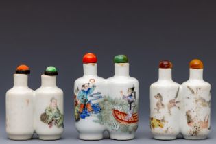 China, three famille rose porcelain 'double' snuff bottles and stoppers, late Qing dynasty (1644-191