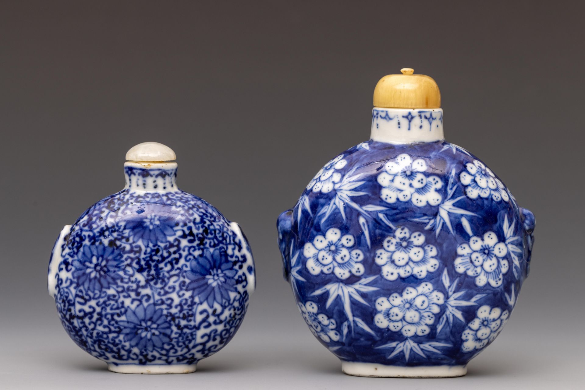 China, two large blue and white porcelain snuff bottles and stoppers, 20th century,