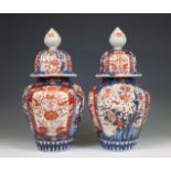 Japan, a pair of Imari porcelain baluster vases and covers, Meiji period (1868-1916),