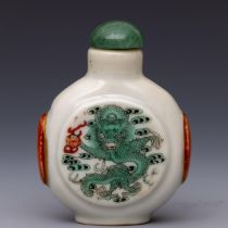 China, a green and iron-red decorated porcelain 'dragon' snuff bottle and stopper, late 19th/ 20th c