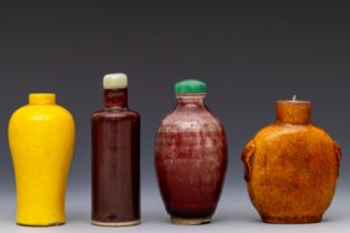 China, four red and yellow-glazed porcelain snuff bottles and two stoppers, 18th-19th century,