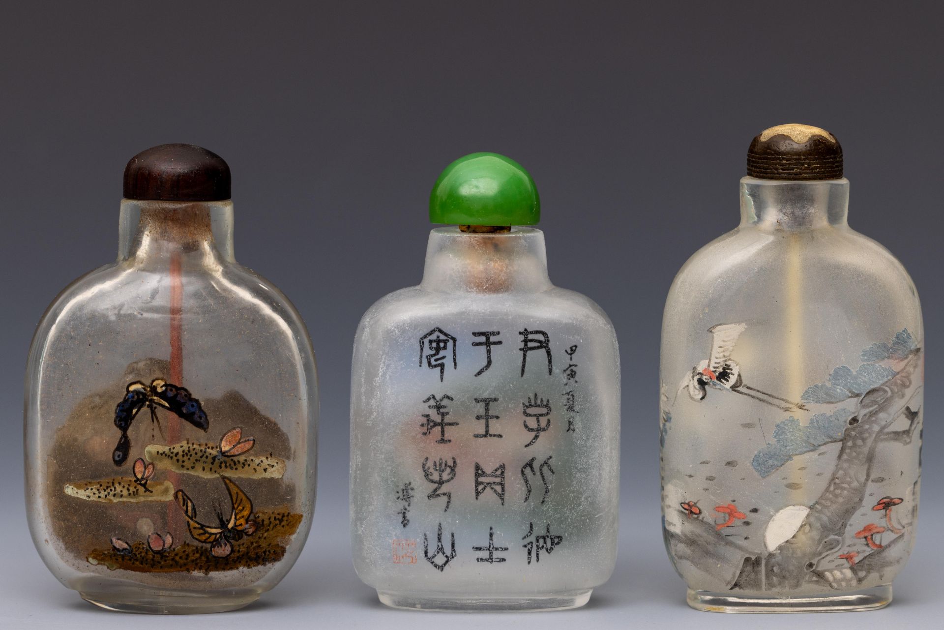 China, three reverse glass painted snuff bottles and stoppers, 20th century,