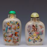 China, two reverse glass painted snuff bottles and stoppers, 20th century,