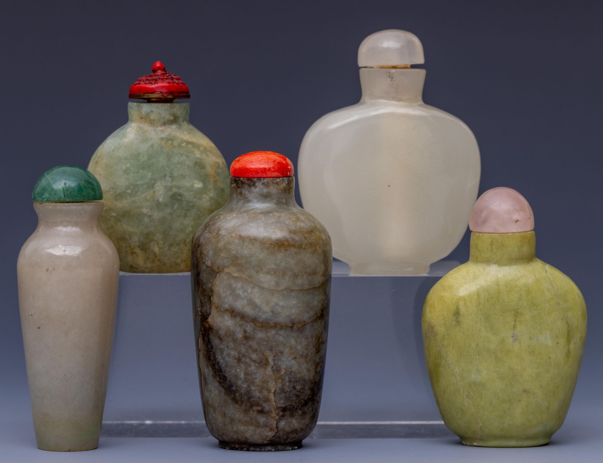 China, five hardstone and soapstone snuff bottles and stoppers,