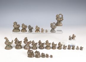 Thailand - Burma, a collection of various bronze opium weights, 19th century and older.