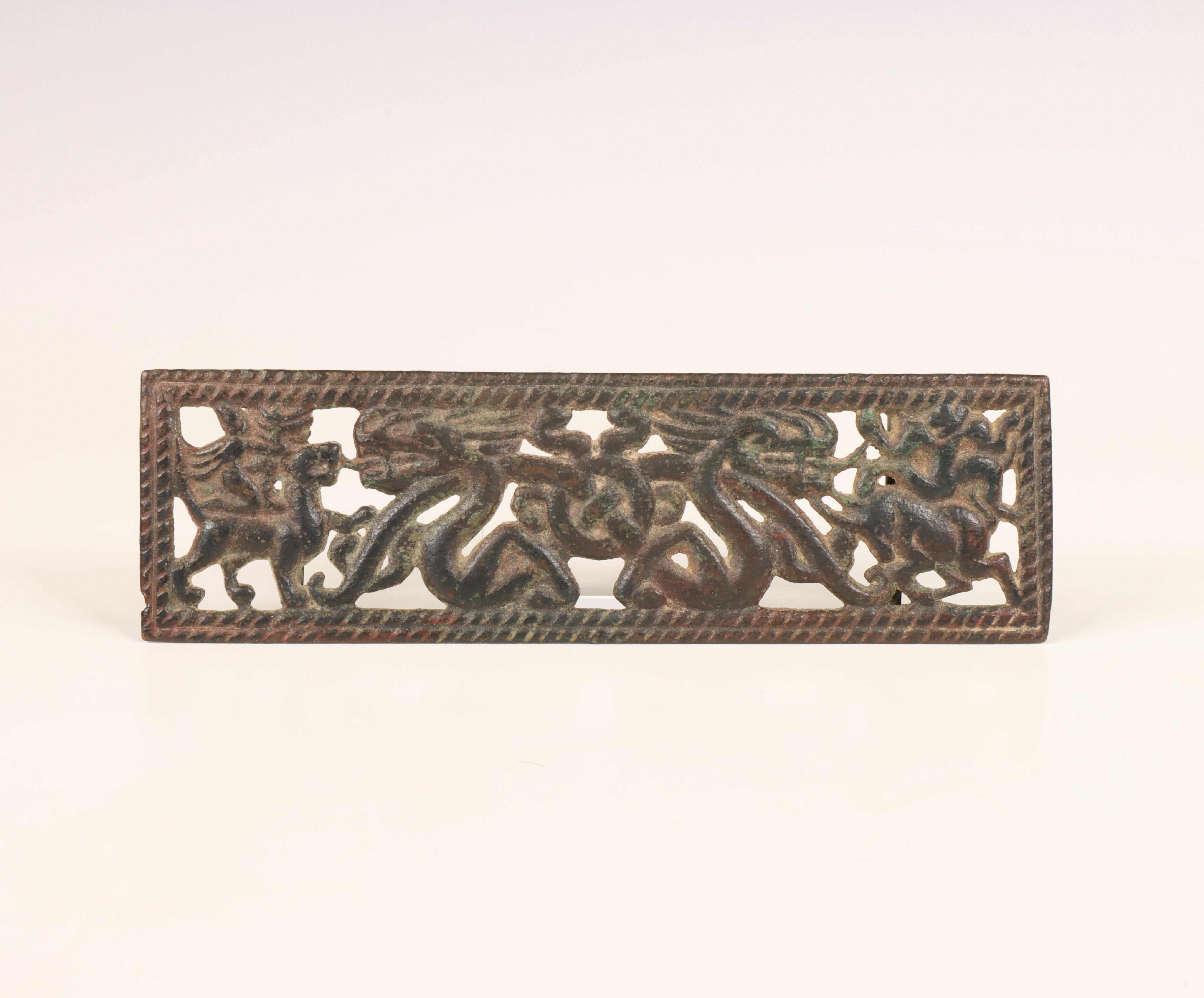 China, an iron 'dragon and Immortal' pendant, probably Han dynasty (206 BC- 220 AD),