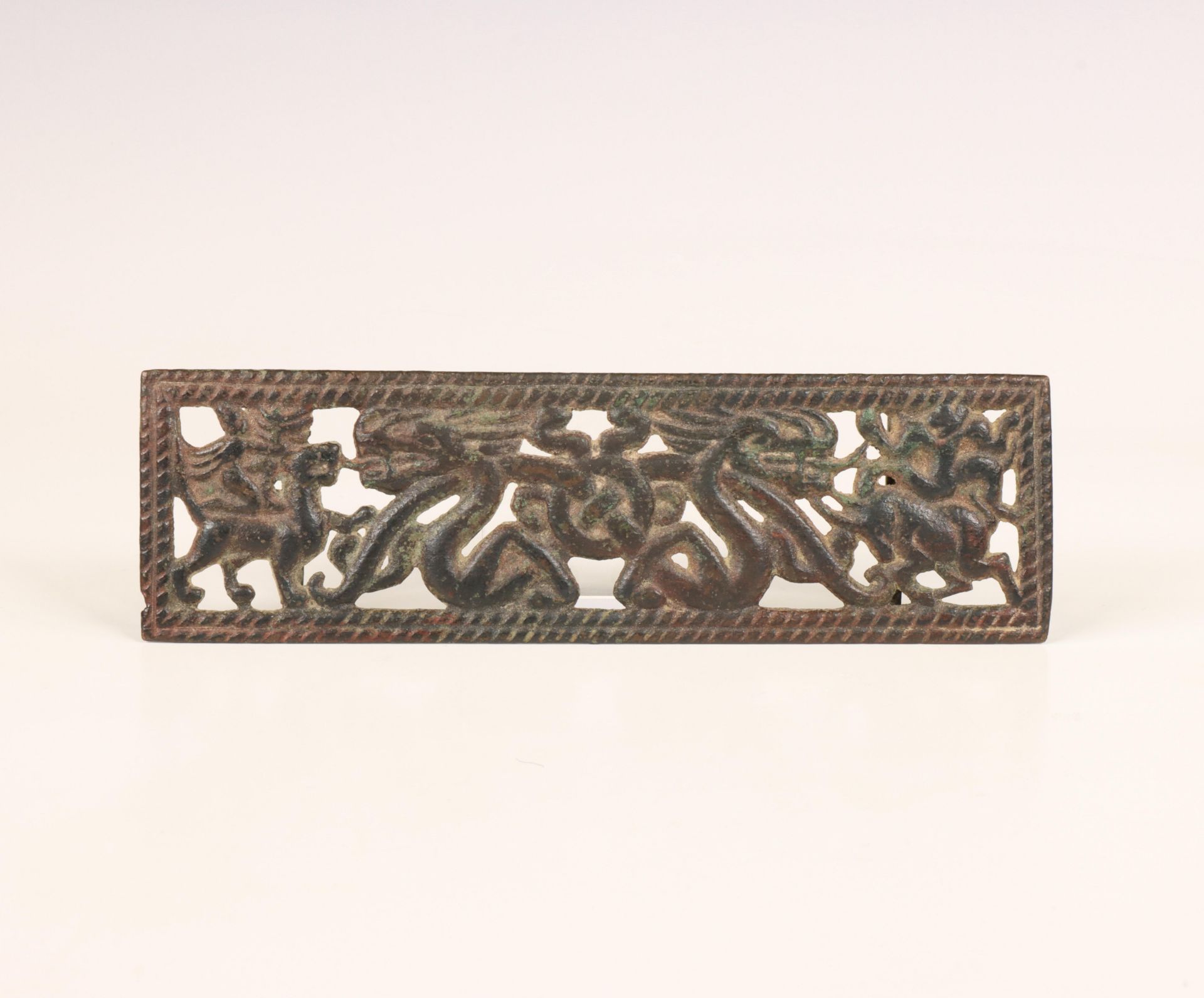 China, an iron 'dragon and Immortal' pendant, probably Han dynasty (206 BC- 220 AD),