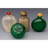 China, four green and translucent glass snuff bottles and stoppers, late Qing dynasty (1644-1912),