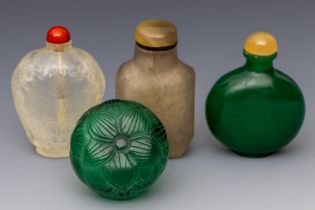 China, four green and translucent glass snuff bottles and stoppers, late Qing dynasty (1644-1912),
