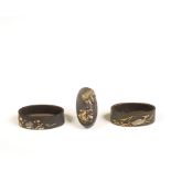 Japan, two iron fuchi and one kashira with gold- and silver inlay, Edo period, (1615-1868);