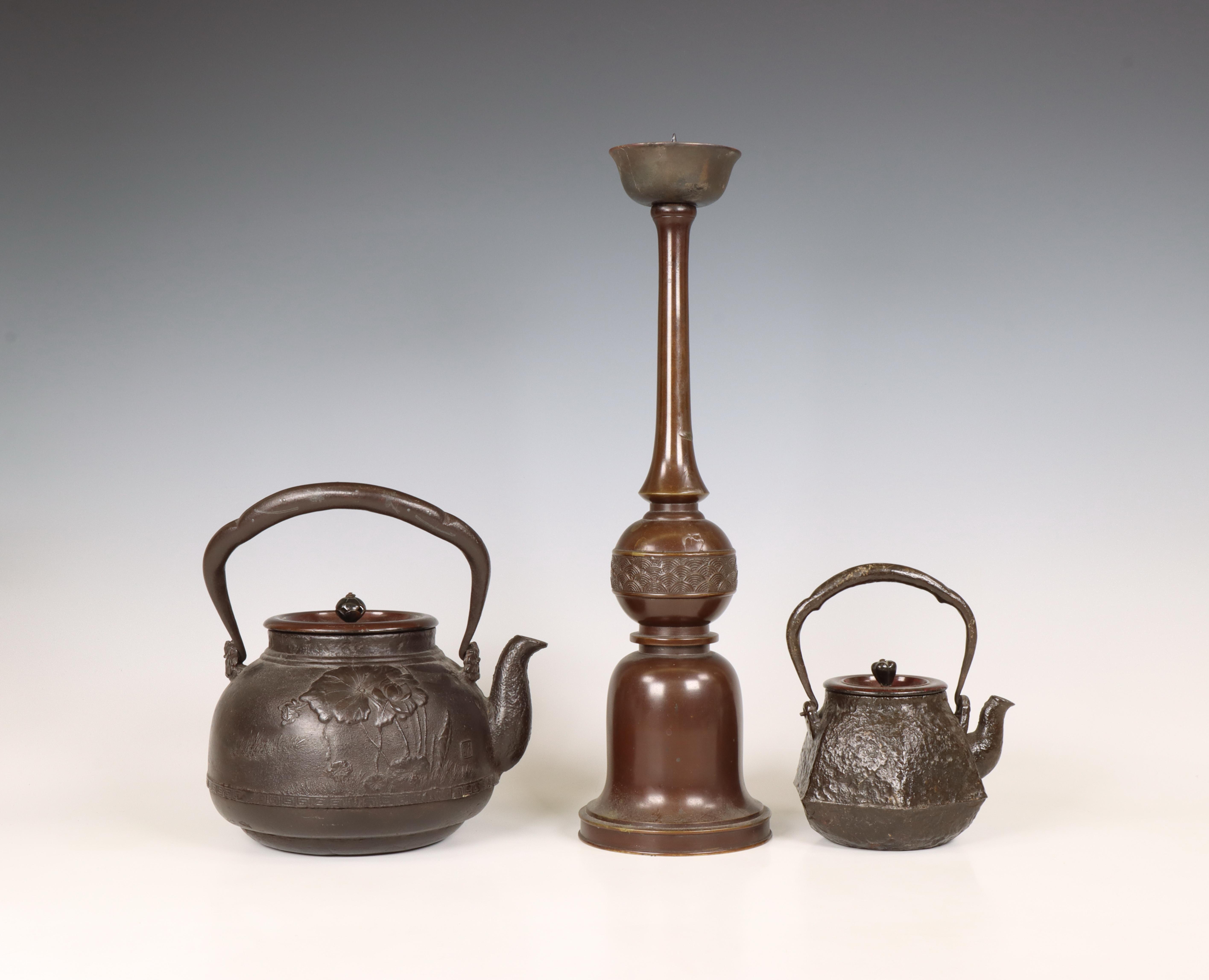 Japan, two iron kettles and a bronze candlestick, 20th century, - Image 2 of 4