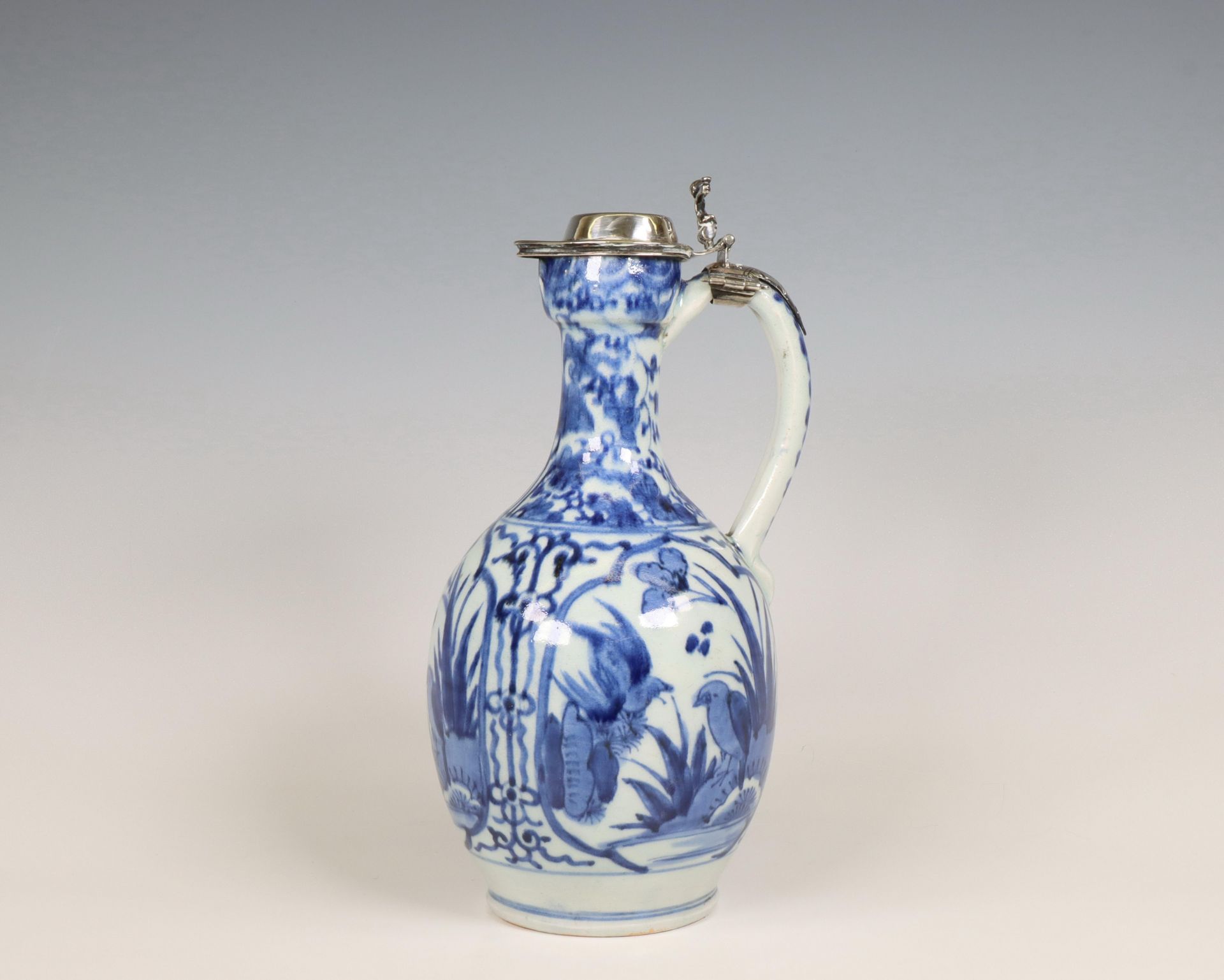Japan, silver-mounted blue and white Arita porcelain jug, mid-17th century, the silver later,