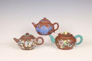 China, three famille rose and blue decorated Yixing teapots and covers, 20th century,