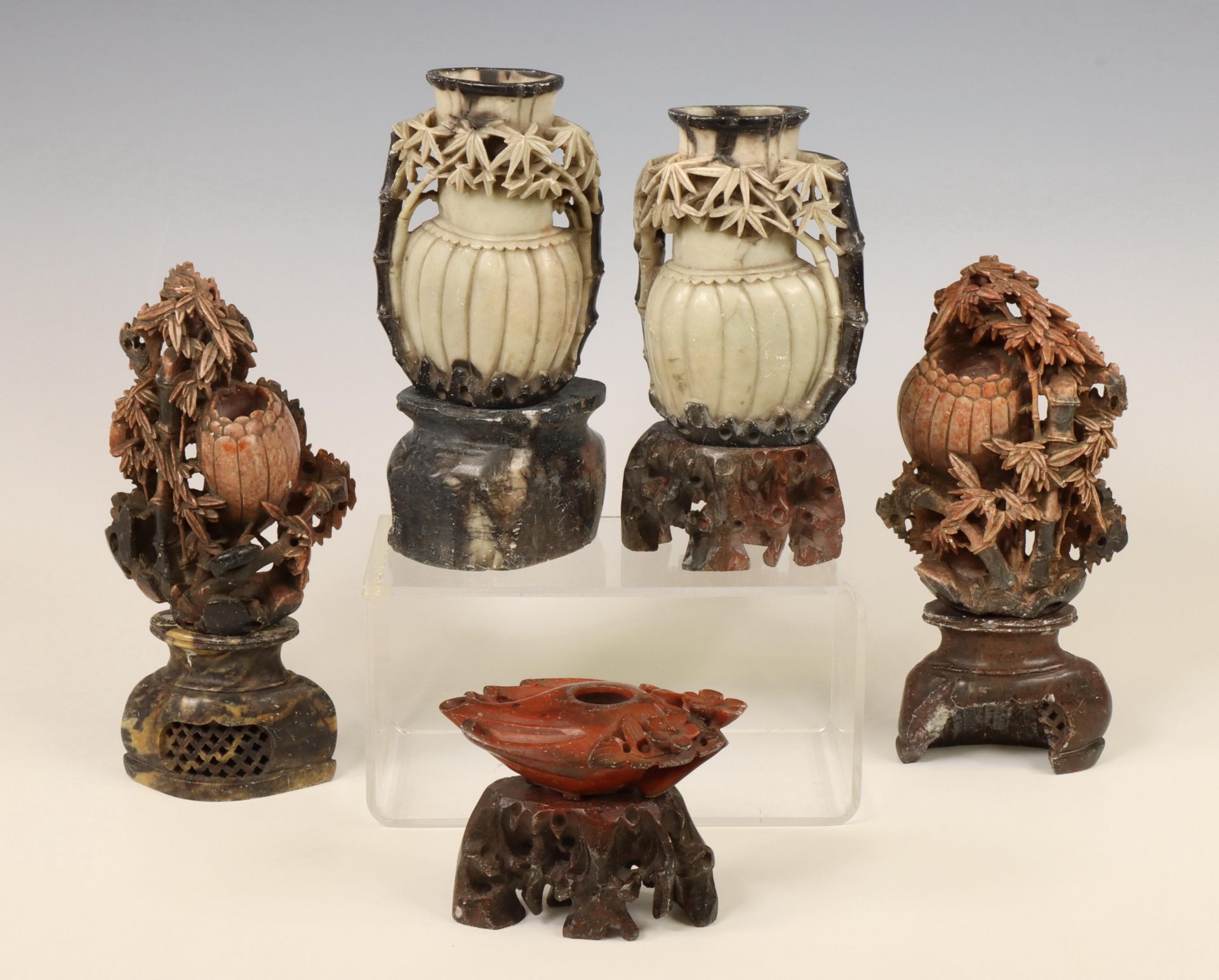 China, a collection of soapstone vases and stands, 19th century,