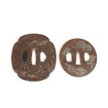 Japan, two iron tsuba's with gold- and silver inlay, Edo period (1615-1868);